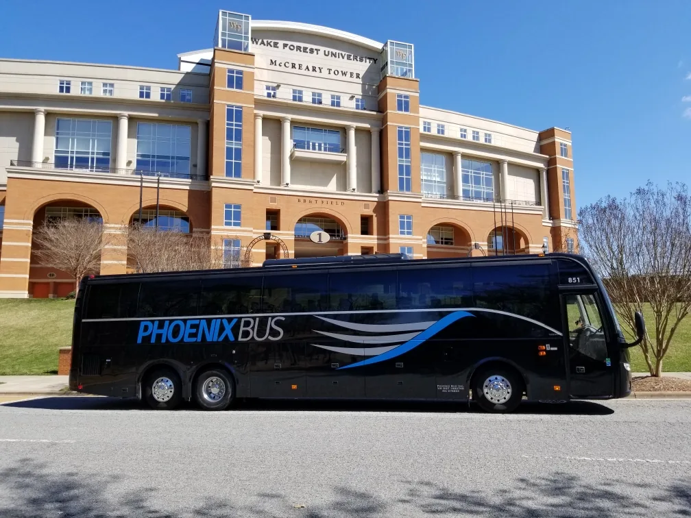 Phoenix Bus motorcoach #851 in front of Wake Forest University McCreary Tower for collegiate charter service