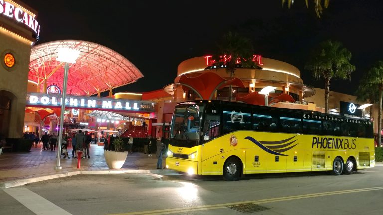 Phoenix Bus 56-passenger coach #811 at Dolphin Mall Miami during evening group transfer